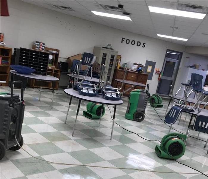 SERVPRO equipment sitting in floor of local board of education that was flooded.